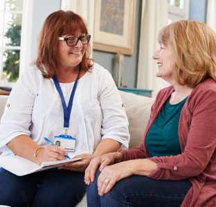 A member of staff listening to a service user