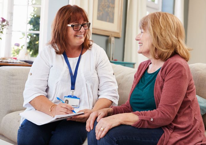 A member of staff listening to a service user