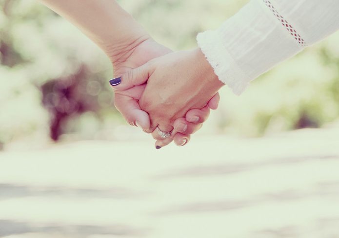 Holding hands for support