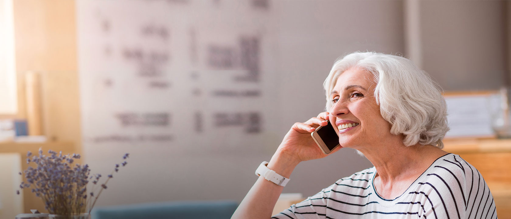 picture of a lady using the phone