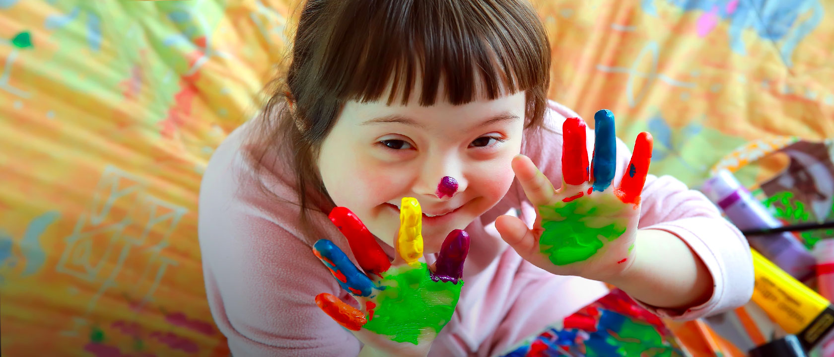 A young girl doing some hand painting