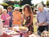 A group of people at a cake stand