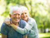 Man and women smiling at the camera