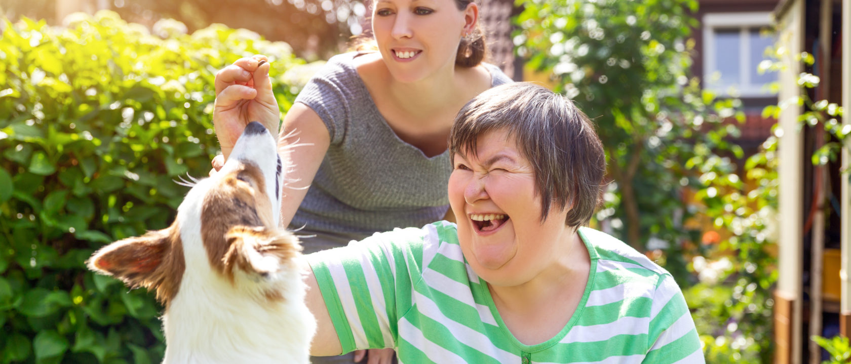 A lady happy to see her dog