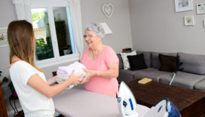 Two ladies ironing