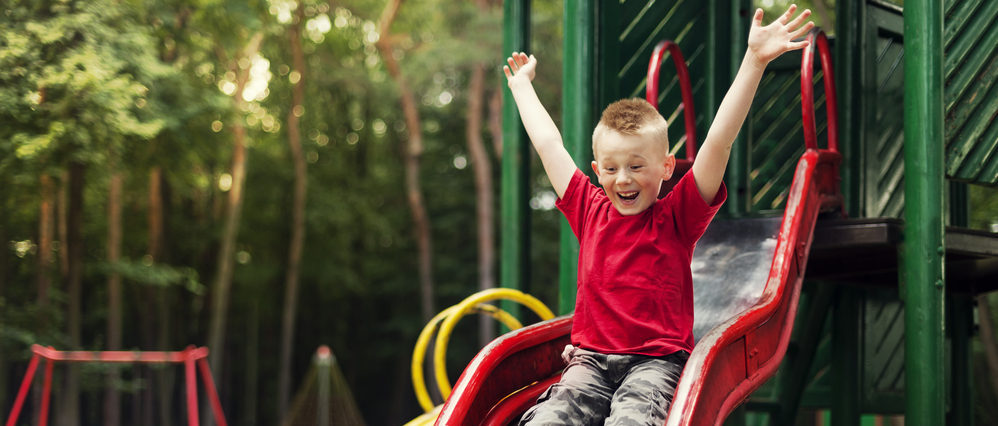 Young boy on a slide