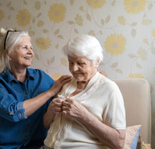 Carer Helping Mother