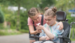 Image of young carer supporting her sister