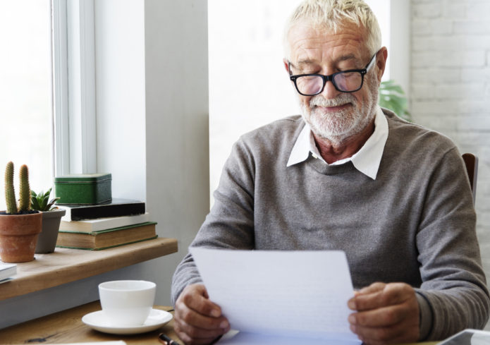 Carer reading a letter