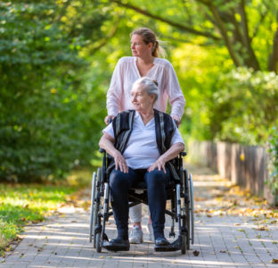 Carer helping mother